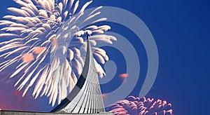 Conquerors of Space Monument in the park outdoors of Cosmonautics museum and fireworks, Moscow, Russia