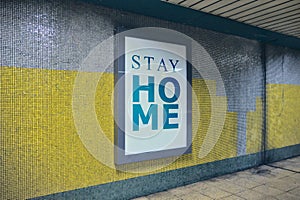 Consciousness raising billboard with the message of stay home request at subway