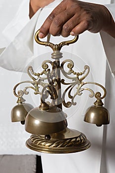 Consecration bells during holy mass photo