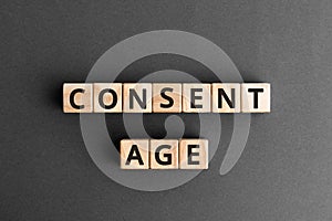 Consent age - word from wooden blocks with letters