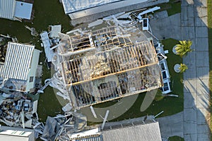 Consequences of natural disaster in Florida, USA. Aerial view of heavily damaged by hurricane Ian houses in mobile home