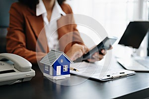 Considering buying a home, investing in real estate. Broker signs a sales agreement. agent, lease agreement, successful deal