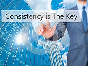 Consistency is The Key - Businessman hand touch button on virtu