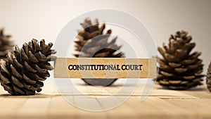 Constitutional Court written on wood patterned surface. Law and state