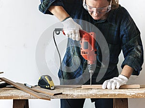 Constractor handyman working and using screwdriver