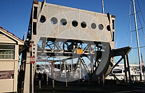 Historic grey Rolling Lift Bridge to Wynyard Quarter at Viaduct Harbor, Auckland, New Zealand