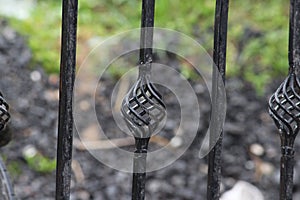 A constructed or fabricated metal gate with many forms of design.