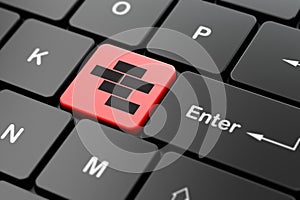 Constructing concept: Bricks on computer keyboard background