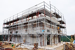 House in construction, scaffold, in Italy, construction site, secure tecniques