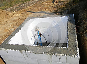 Constructing a pump house, pumping station, water borehole chamber from Insulating concrete forms ICF, concrete walls between photo