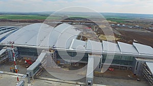 The construction of the airport with runway. Aerial view of Airport runway become a construction site. workers build the