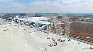 The construction of the airport with runway. Aerial view of Airport runway become a construction site. workers build the