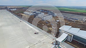 The construction of the airport with runway. Aerial view of Airport runway become a construction site. workers build the