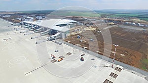 The construction of the airport with runway. Aerial view of Airport runway become a construction site. workers build the