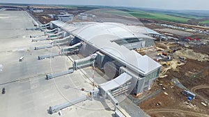 The construction of the airport with runway. Aerial view of Airport runway become a construction site. workers build the