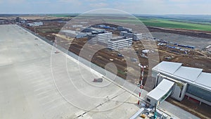 The construction of the airport with runway. Aerial view of Airport runway become a construction site. workers build the