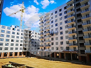 construction of apartment buildings with the participation of builders and a tower crane