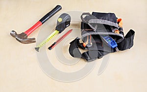 Construction bag for belt and some working instruments tools on plywood of surface