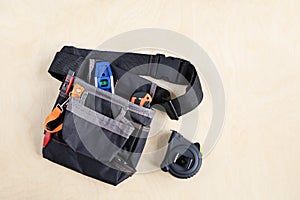 Construction bag on belt for working tools on plywood of surface