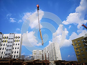 construction of a basement floor for office space at a construction site and a cable from a construction tower crane