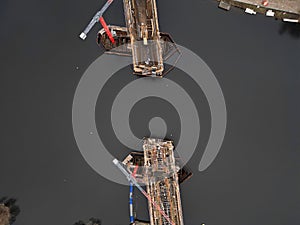 construction of bridge ove river. casting concrete into wire struts,