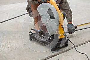 Construction builder worker with grinder machine cutting metal r