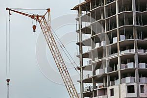 Construction of the building with crane.