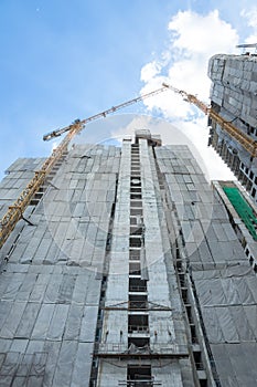 Construction of building with cranes