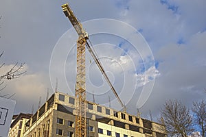 Construction Building Site With Industrial Mid-Size Crane. HDR Image Toning.