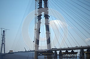 Construction of the cable-stayed bridge. Cable-stayed pylon in foreground