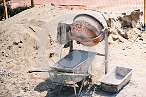 Construction - Cement mixer machinery used on construction site for preparing mortar and building brick walls