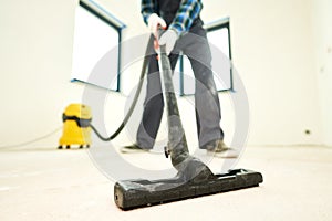 construction cleaning service. dust removal with vacuum cleaner