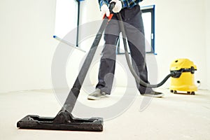 construction cleaning service. dust removal with vacuum cleaner