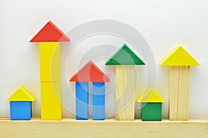 Construction with colored wooden blocks, with white background photo