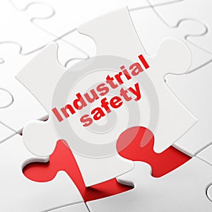 Construction concept: Industrial Safety on puzzle background