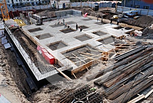 Construction of concrete foundation of building photo