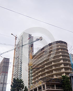 Construction of a concrete house. Modern buildings. Industrial background