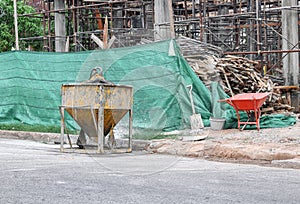 Construction. Concrete mixer container at construction site, se