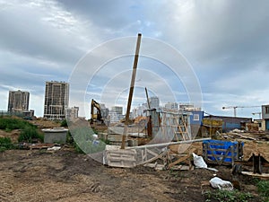 Construction with construction equipment of many new buildings houses with cranes