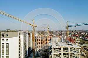 Construction and construction of high-rise buildings, the construction industry with working equipment and workers. View from