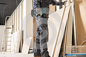 Construction Contractor Worker Preparing Drywall Boards