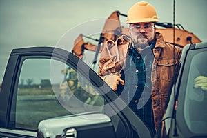 Construction Contractor Worker with Tool Belt on His Shoulder