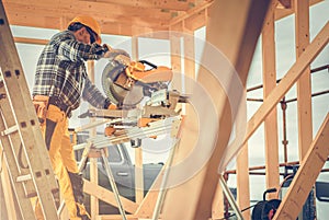 Construction Contractor Worker Using Powerful Wood Saw