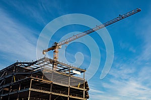 Construction crane against blue sky