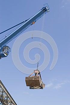 Construction crane with bucket