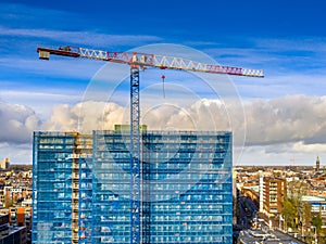 Construction crane building high rise apartment