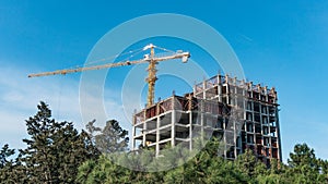 Construction crane building a house