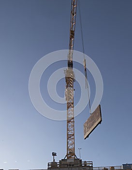 Construction crane in building industry