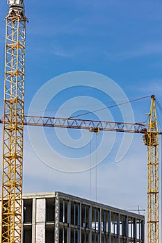 construction crane building real estate against a blue sky background