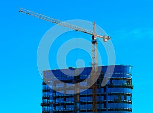 Construction crane building skyscraper background